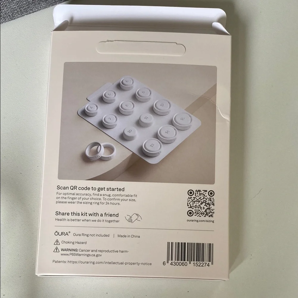 Oura Ring sizing kit with black, silver, gold rings